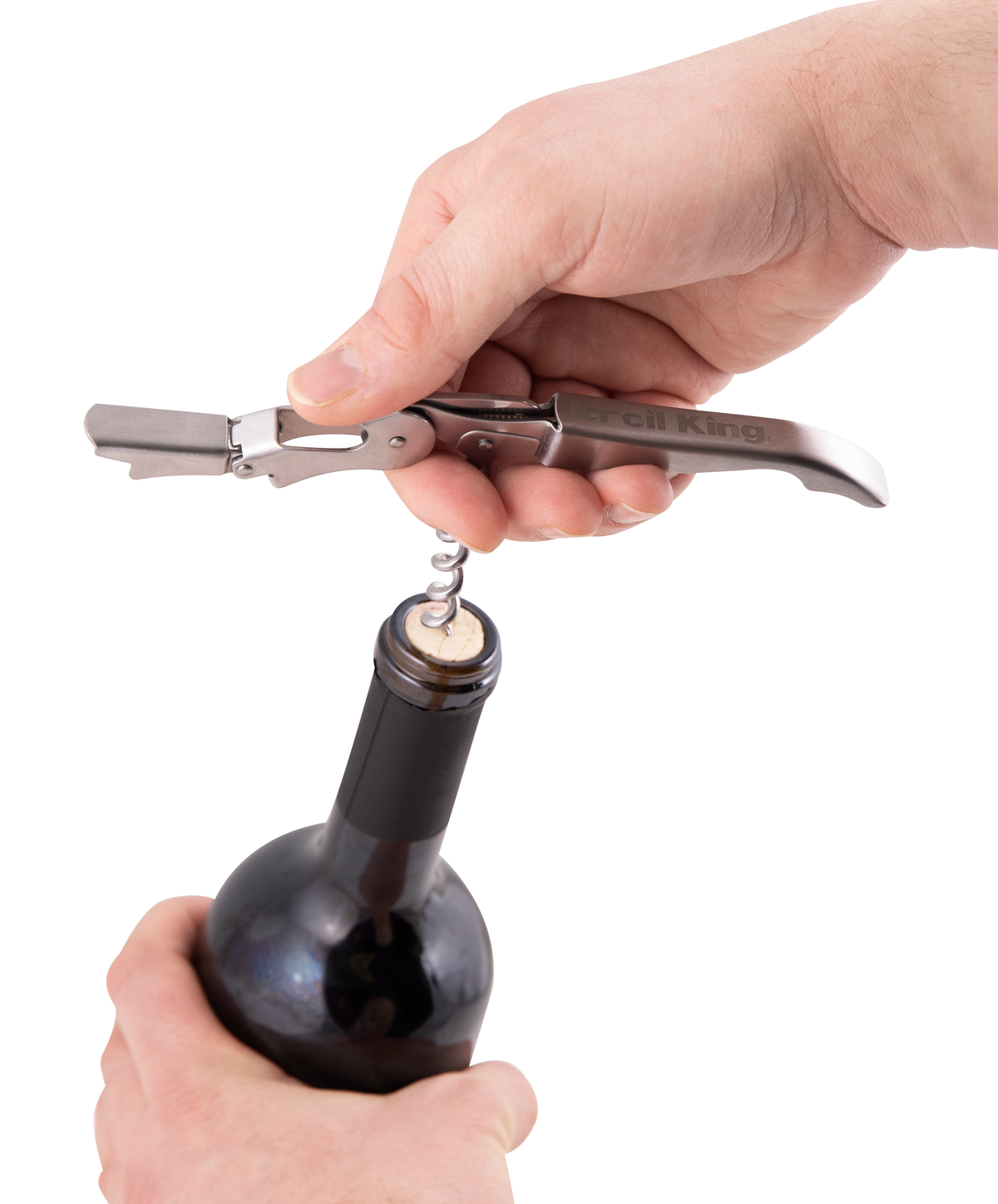 Wine and bottle opener being used to remove a cork