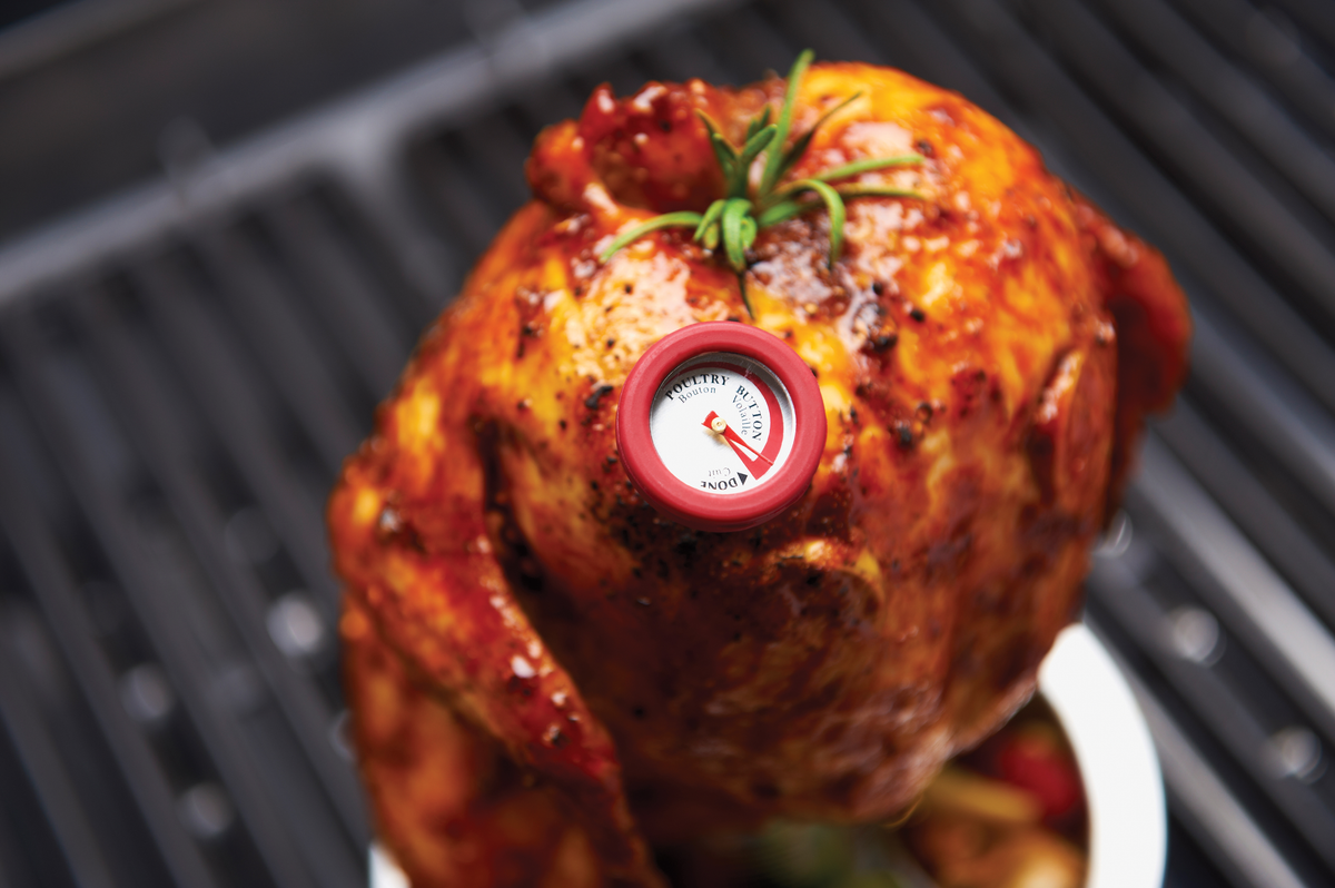 Mini thermometer inserted into roast chicken