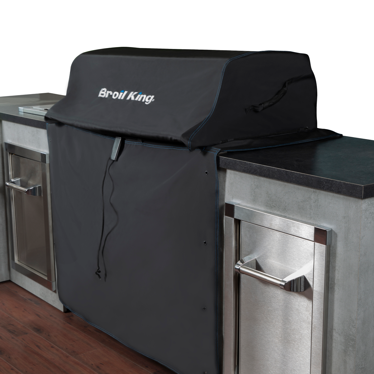 Protective cover shown over a built-in grill beside separate cabinets