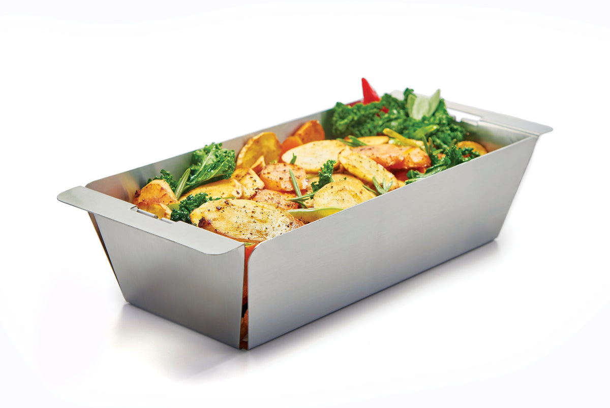 Chicken and vegetables in a narrow stainless steel wok