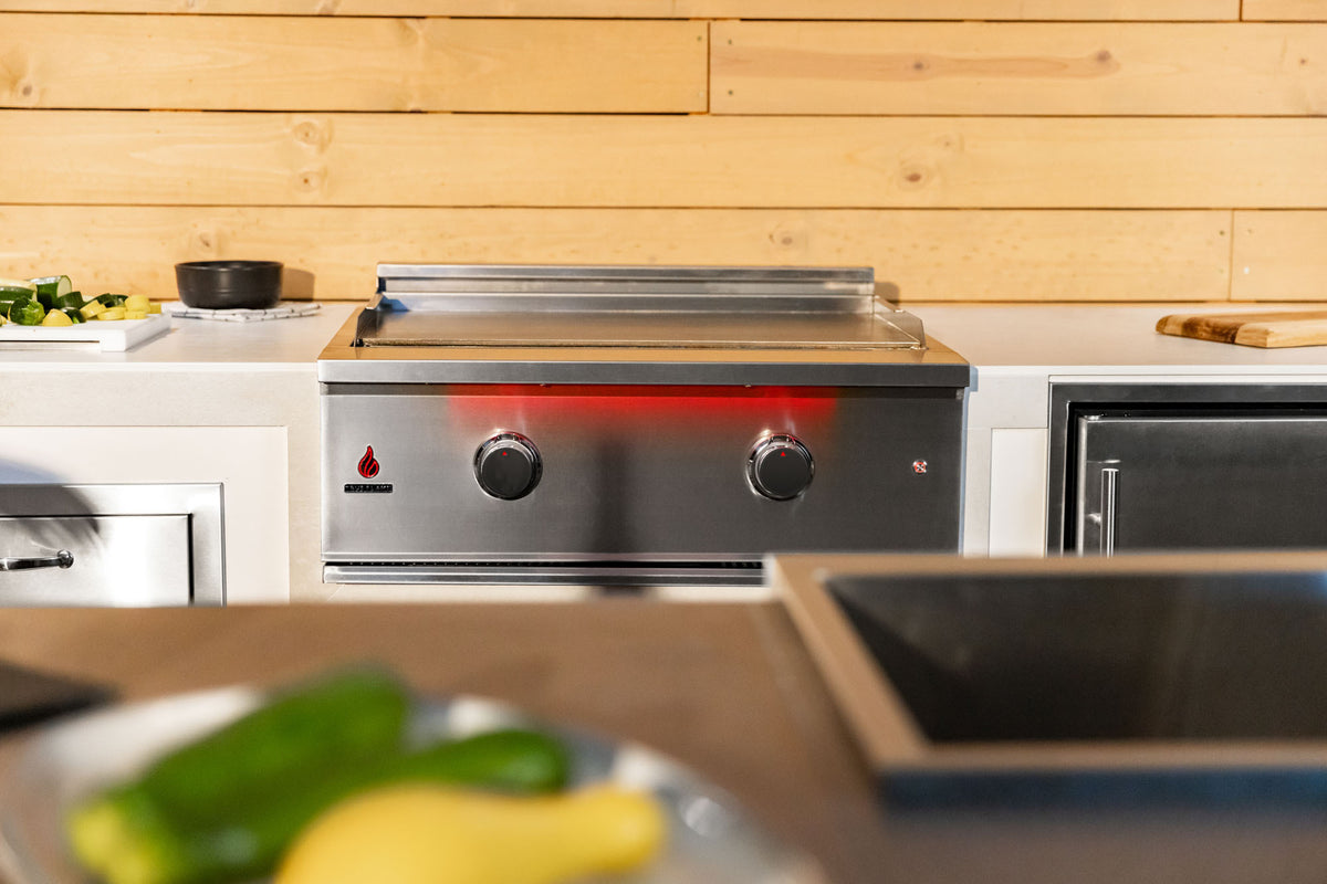 TrueFlame 30" Griddle Grill shown in an outdoor kitchen; surrounding products sold separately