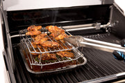 Stacking rack supporting chicken wings over a pan on the grill
