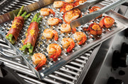Food on an Imperial flat grill topper inside a separate grill