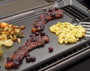 Breakfast foods cooking on a Porta-Chef and Gem griddle