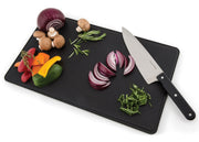 Vegetables and a knife arranged on the Porta-Chef tool set cutting board
