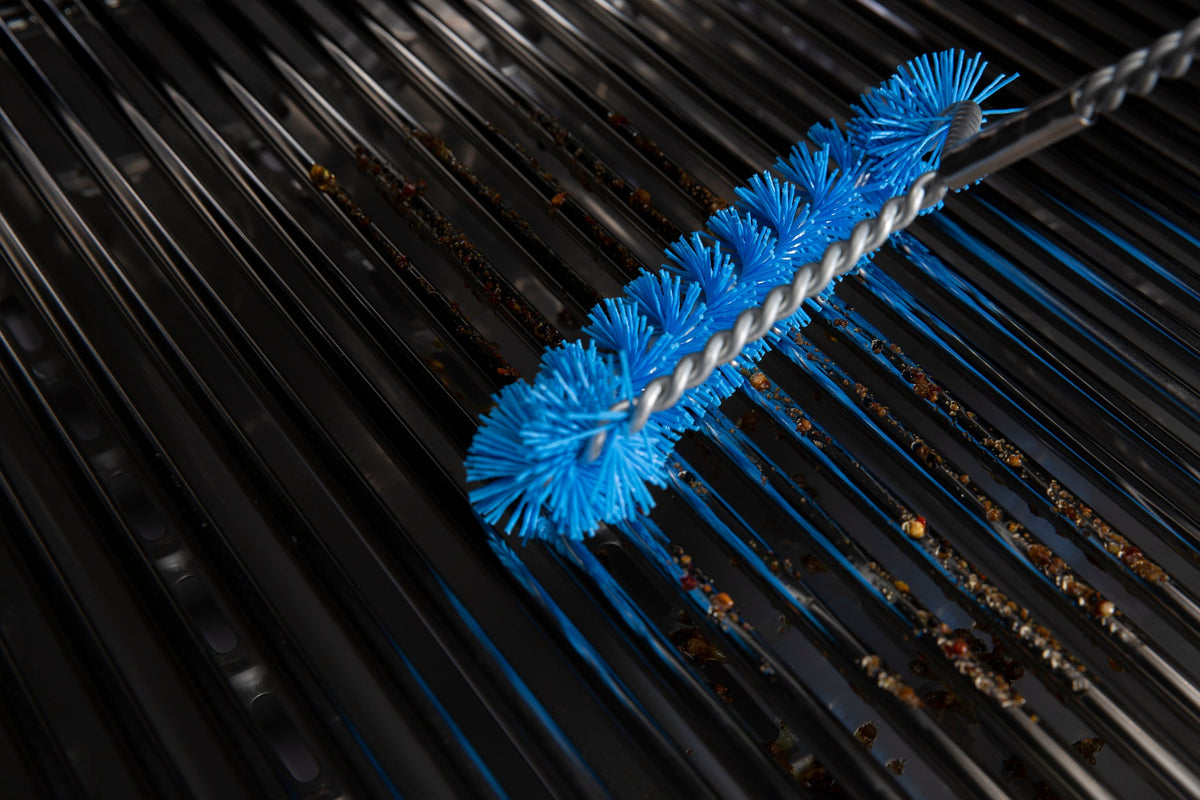 Blue nylon brush cleaning grill cooking grids