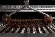 Tri-head Palmyra brush positioned on cooking grids
