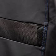Close-up of a built-in grill-cover vent and blue stitching