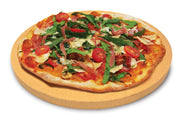 Topped pizza resting on a round grilling stone