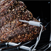 Temperature probe inserted into a roast