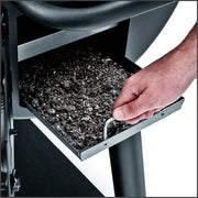 Removable metal ash tray beneath the charcoal cooking area