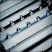 Stainless steel Flav-R-Wave plates beneath the cooking surface