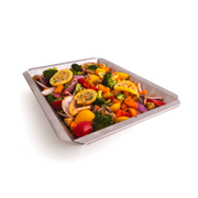 Vegetables arranged in a stainless steel shelf insert wok