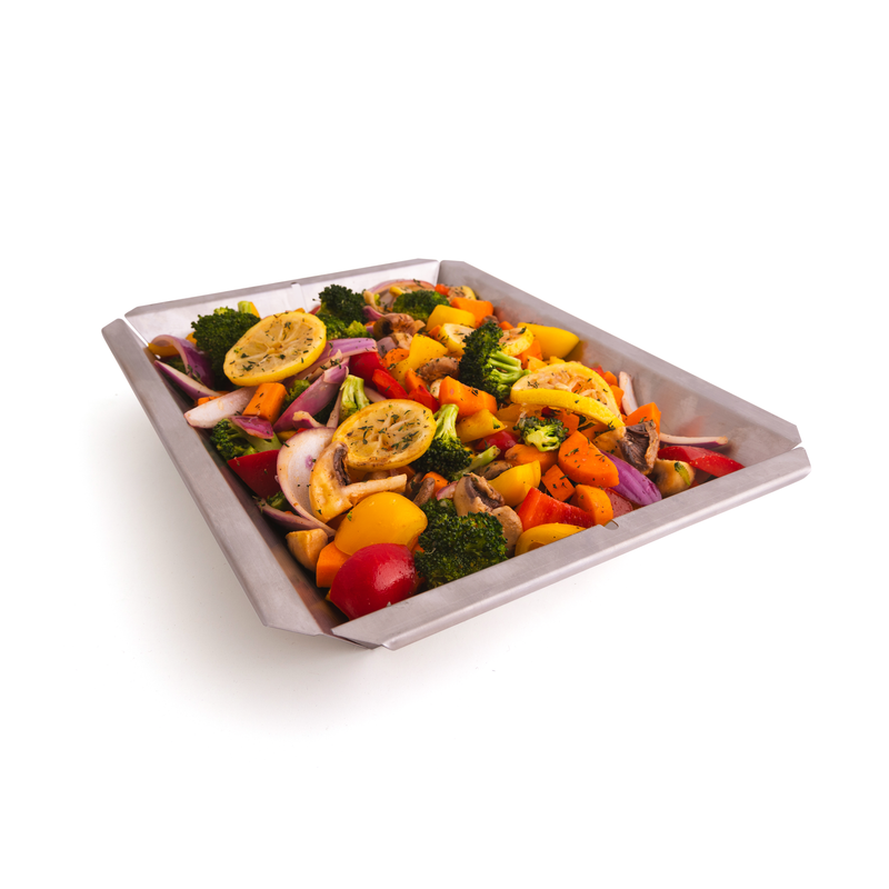 Vegetables arranged in a stainless steel shelf insert wok