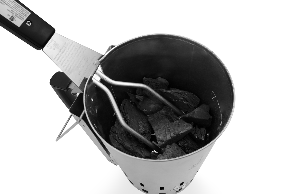 Charcoal chimney starter loaded with charcoal
