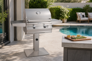 C430s patio post-mount grill beside a pool with prepared vegetables