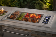 Hoodless E540d drop-in grill cooking in an outdoor kitchen