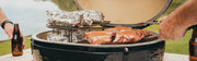 Primo XL with food on the cooking grate and optional raised rack