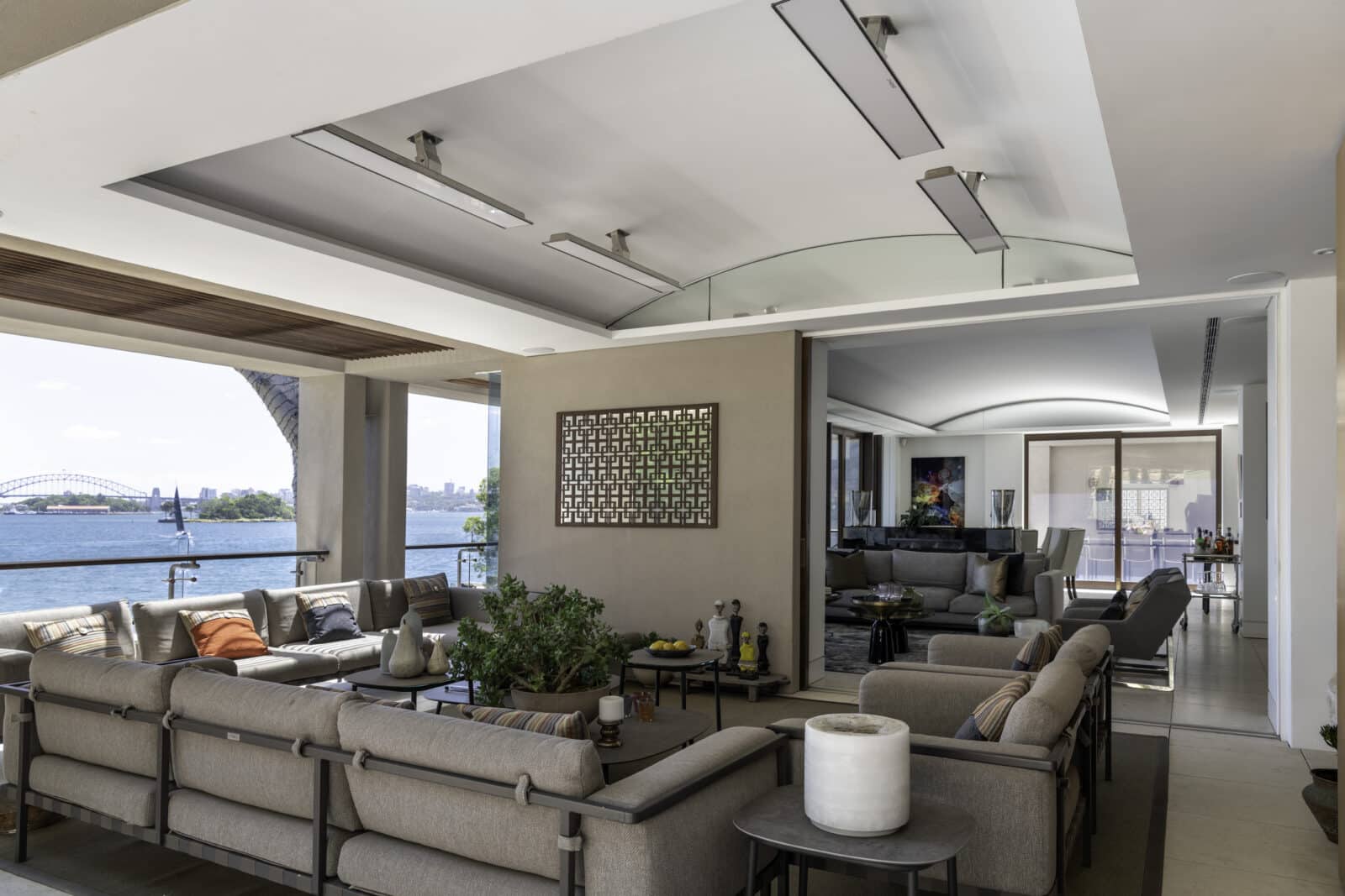 Bromic Platinum Marine heaters above a waterfront lounge overlooking Sydney Harbour